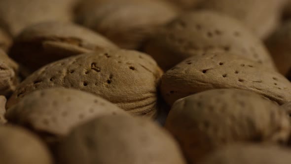 Cinematic, rotating shot of almonds on a white surface - ALMONDS