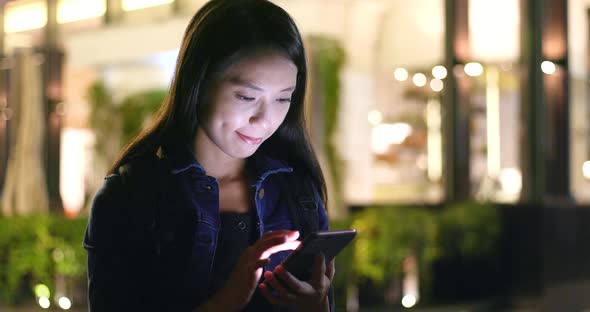 Woman use of cellphone at night 