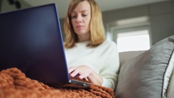 Woman Working at Home with Laptop