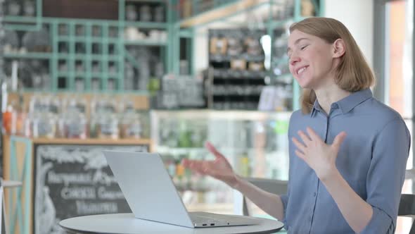 Young Woman Talking on Video Call on Laptop