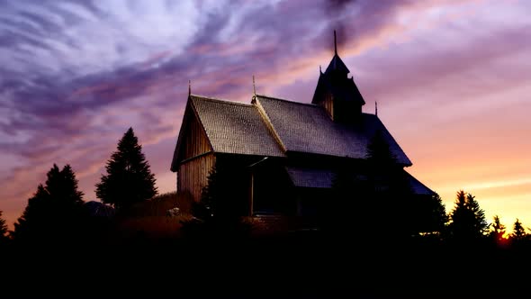 Wooden Chalet and Forest at Sunset View