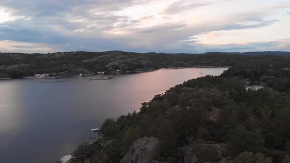 Exploring the bays and coastline of Kragerofjorden, Norway, sunset drone view