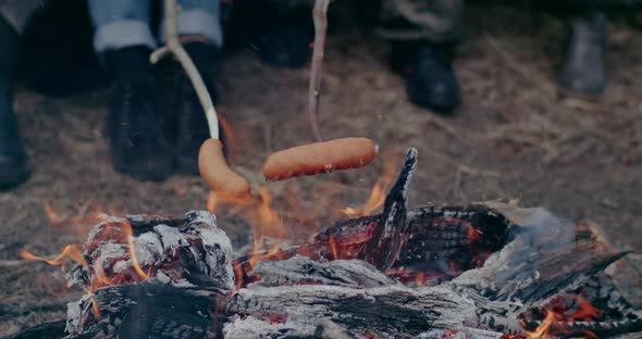 Refugees Roasting Sausages At Bonfire In War Crisis