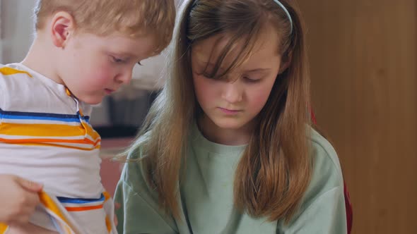 Brother And Sister With Tablet