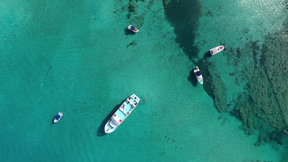 Overhead view of the tourists sunbathing on the cruise boat