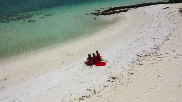 Beautiful women sunbathing on beautiful coast beach adventure by blue water and white sandy backgrou