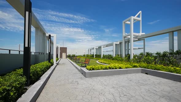 Modern Style Garden on the Buiding Rooftop with Clear Blue Sky Background