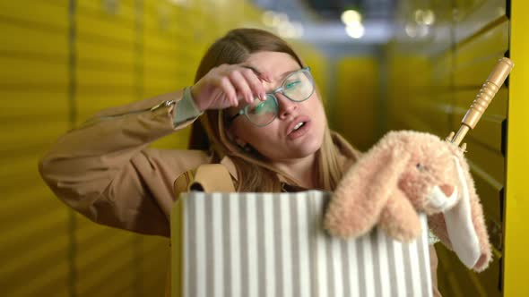 Portrait of Tired Young Beautiful Woman with Heavy Box Rubbing Forehead Sighing Looking at