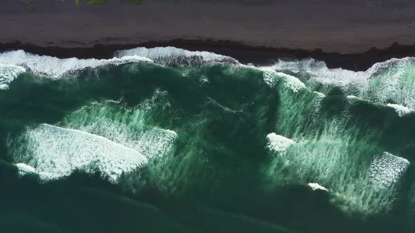 Aerial Top View of Beach with Black Sand