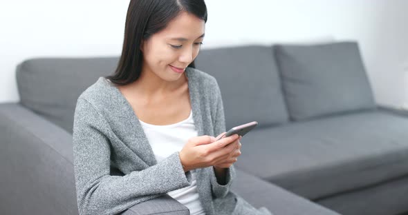 Woman Use of Smart Phone at Home