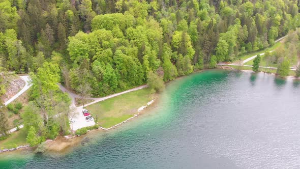 Scenic Aerial View of Mountain Lake with Turquoise Clean Water and Green Forest