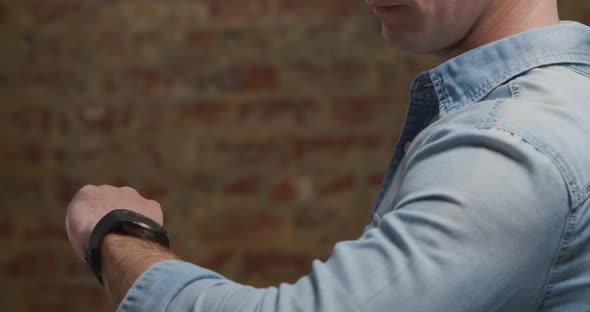 Man checking smartwatch