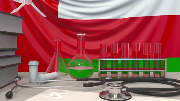 Clinic Laboratory Equipment on the Omani Flag Background alt