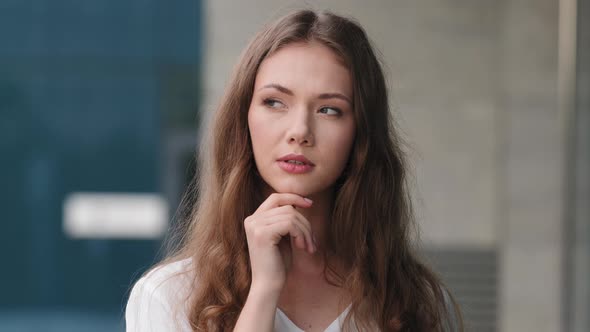 Woman Portrait Outdoors Caucasian Millennial Beautiful Pensive Girl Puzzled Embarrassed Woman Model