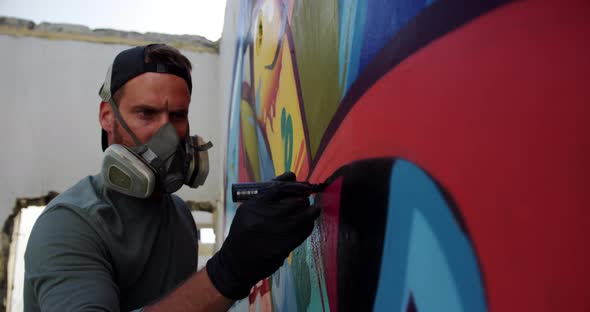 Graffiti artist painting with marker on the wall 4k