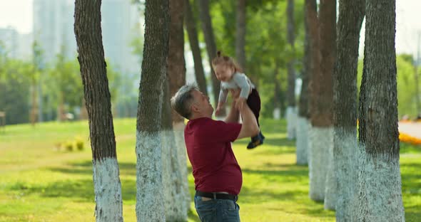 Father Throws the Baby Up Joyful Moments of Life