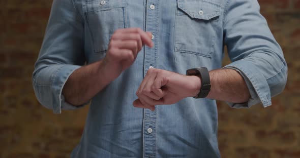 Man checking smartwatch