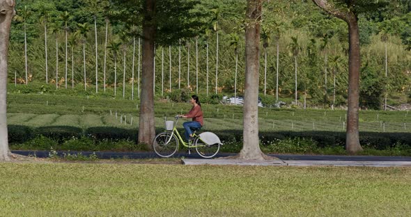 Woman ride a bike in countryside