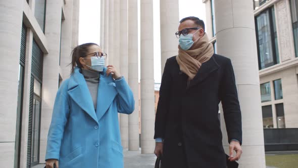 Business Colleagues Wearing Protective Masks Talking Meeting in City