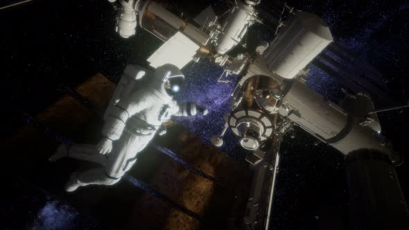 Astronaut Outside the International Space Station on a Spacewalk alt