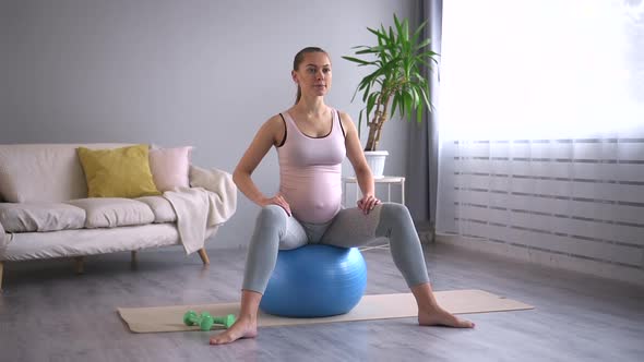 Pregnant Woman Sit Ob Yoga Ball and Relax