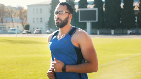 Man Goes Jogging in Stadium