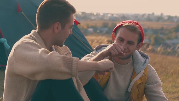 Guy Talks To Boyfriend and Hits Fists Friendly at Blue Tent