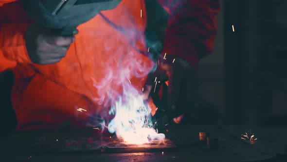 Metal Welder Working with Arc Welding Machine