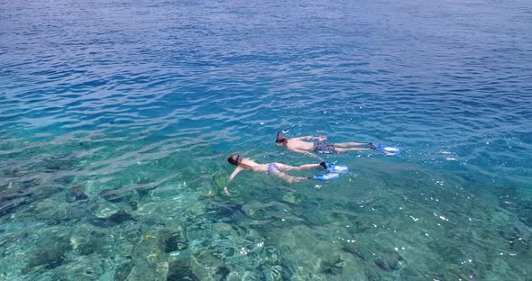 Happy boy and girl after marriage in love have fun on beach on paradise white sand 