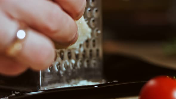 Grated Cheese on a Table Full of Vegetables