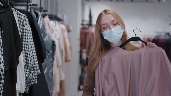 Blonde Caucasian Girl in Medical Mask Female Client Buyer Customer Woman in Covid Pandemic Shopping