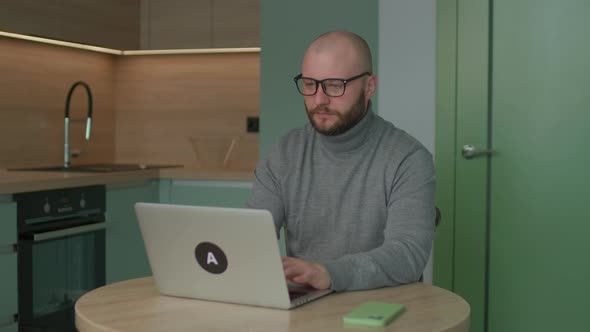 Young Adult Man Using Laptop
