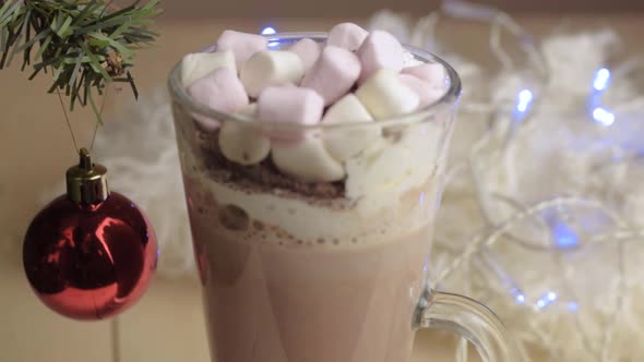 Whipped cream and marshmallows toppings on hot chocolate drink at Christmas