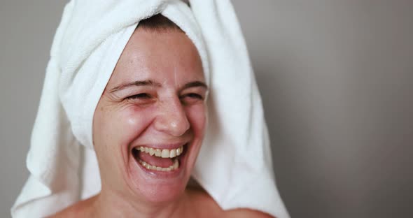 Mature caucasian woman smiling on camera - Body treatment for an healthy lifestyle concept
