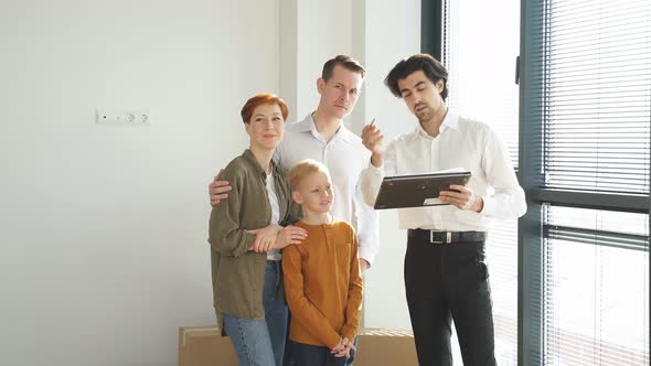 Pleasant Real Estate Agent In Formal Wear Representing New House To Customers