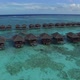 Aerial view of wooden over water villas in Maldives. Tropical paradise in luxury resort - VideoHive Item for Sale
