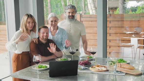 Family Talking on Video Call in Modern House