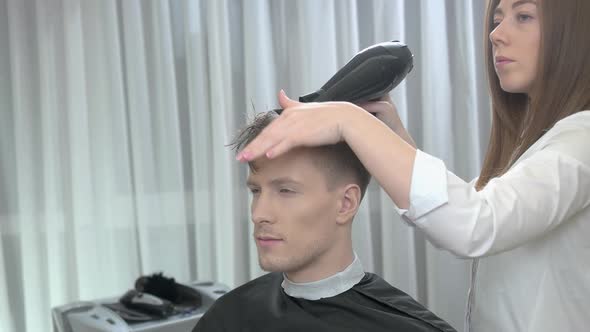 Female Barber Drying Hair