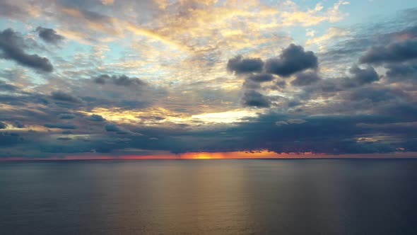 Sunset Over the Sea Flew Away on a Drone in the Sun