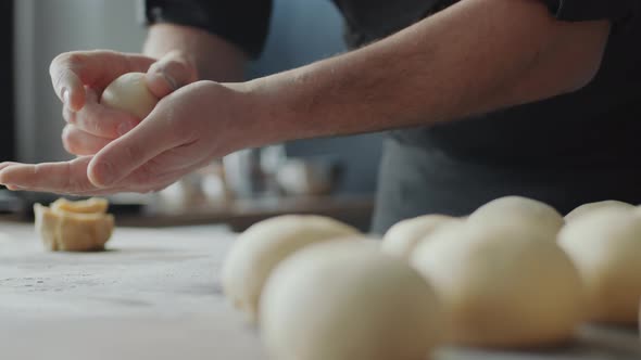 Baker Making Dough Balls