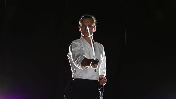 Man Fighting at Aikido Training with Japanese Sword Katana in Martial Arts School. Healthy Lifestyle