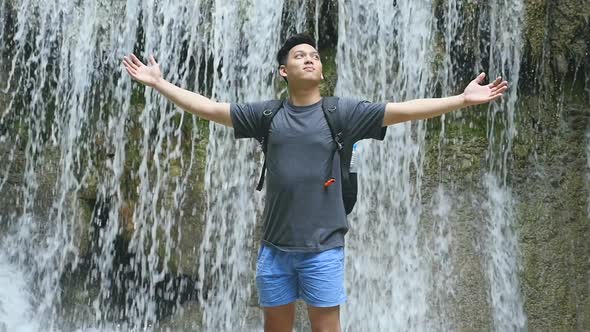 Man Relaxing With Waterfall