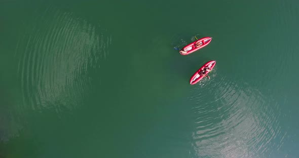 Friends paddling canoe on river on Mreznica river, Croatia