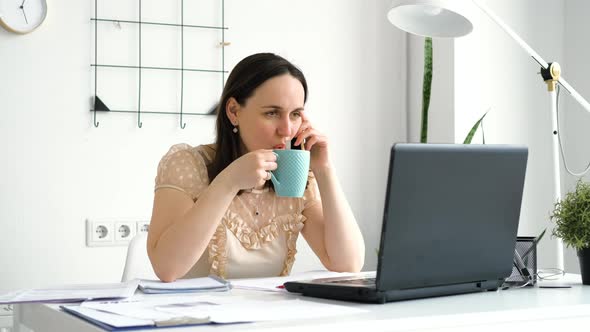 Female Employee Talking on Phone in the Office