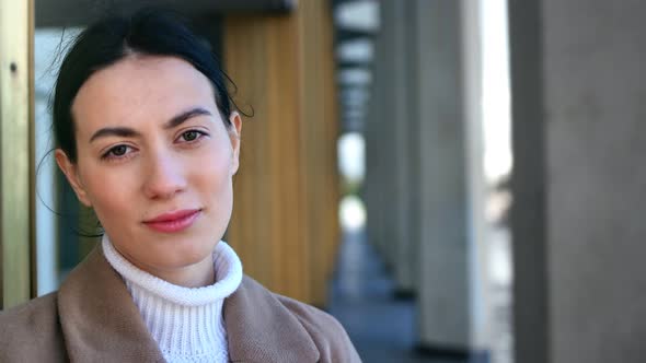 Portrait of Smiling Woman Posing Outdoor Near Modern Building