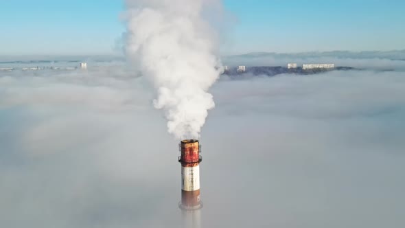 Aerial drone view of Chisinau. Tube of the thermal station with smoke coming out