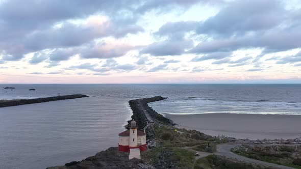 Scenic Coquille Lighthouse in Bandon, Oregon Coast. Aerial view. Drone pullback.