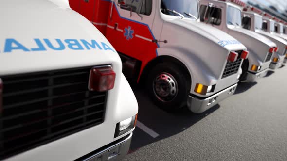 An endless row of ambulance trucks standing in front of a hospital. 4KHD