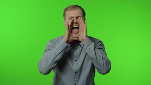 Expressive Man Screaming and Shouting. Studio Portrait of Handsome Person on Chroma Key