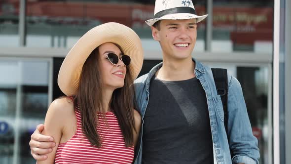 Couple Traveling At Airport On Summer Vacation